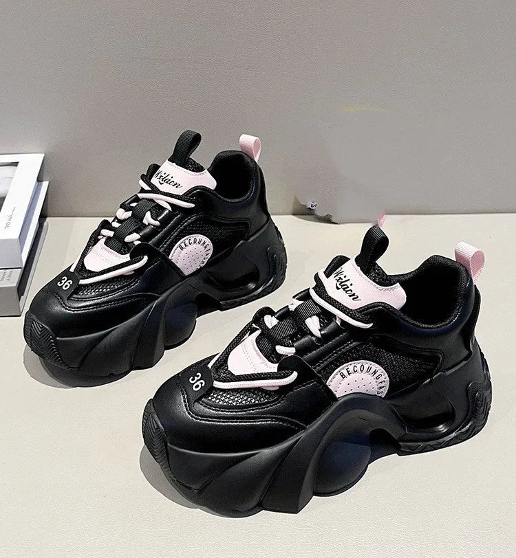 Women's pink sneakers with cross strap design and thick platform sole