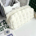 Cream puff texture polyester pencil case in beige and black colour options