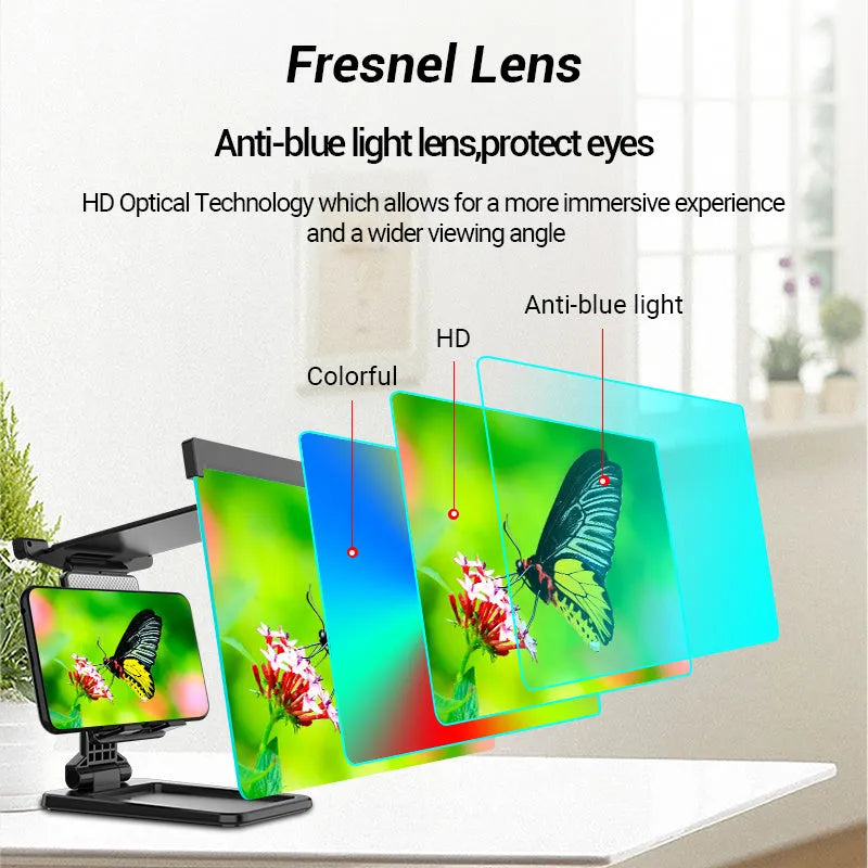Black foldable mobile phone screen magnifier with a detachable phone holder on a desk.