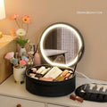 Round cherry blossom pink PU leather makeup bag with a lit LED mirror inside, showing internal partitions.