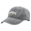 Retro distressed baseball cap with embroidered letters on the front, shown in a beige colour.