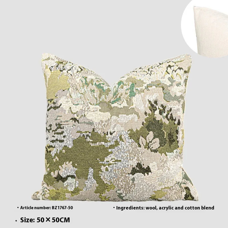 Green wool blend cushion cover with a spring flowers botanical pattern, shown in square and lumbar sizes.