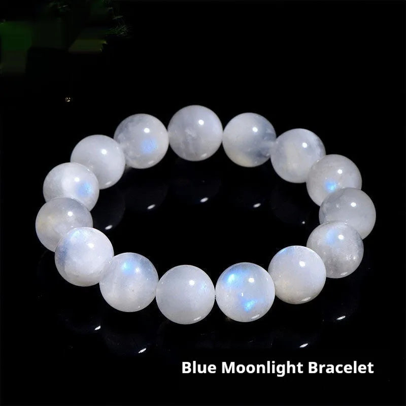 Natural blue moonlight polished moonstone round bead bracelet on wrist.