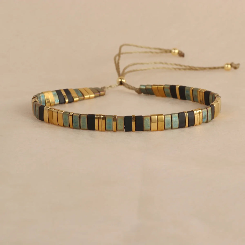 Geometric glass bead bracelet in milky white, black, retro green, light blue, or red colours.