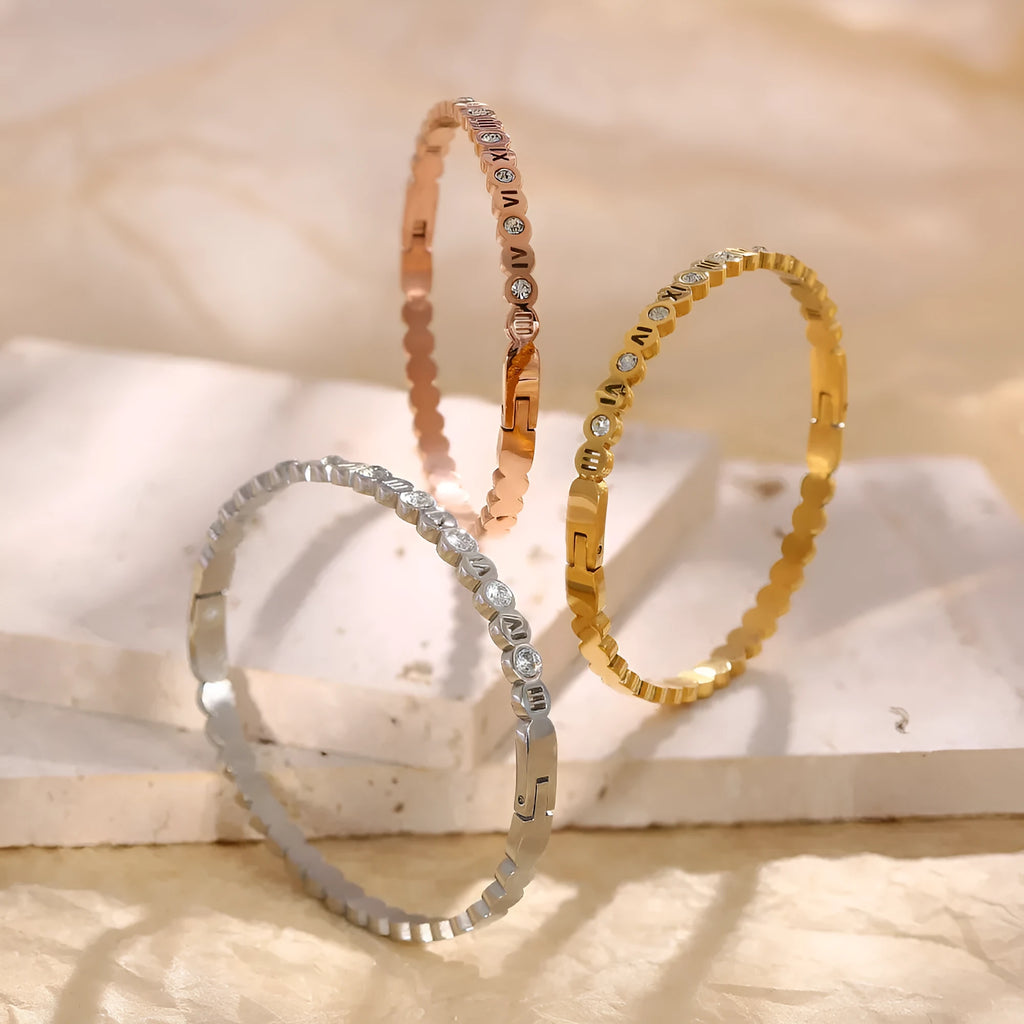 Korean style titanium steel bracelet showing gold rose gold and steel colour options with number decoration