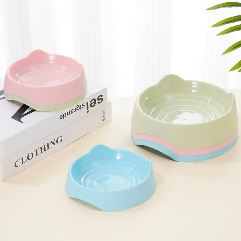 Ceramic dog slow feeder bowl with puzzle cups in blue, shown in large and small sizes.