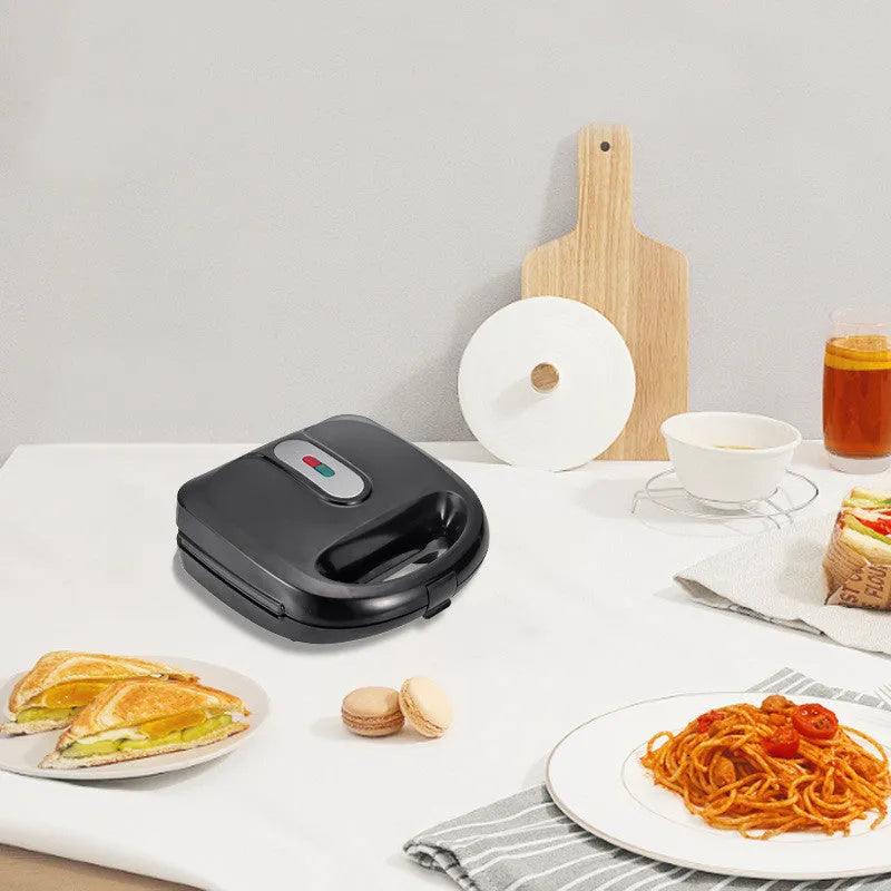 Black double-sided electric sandwich pan with non-stick coating and brushed stainless steel top