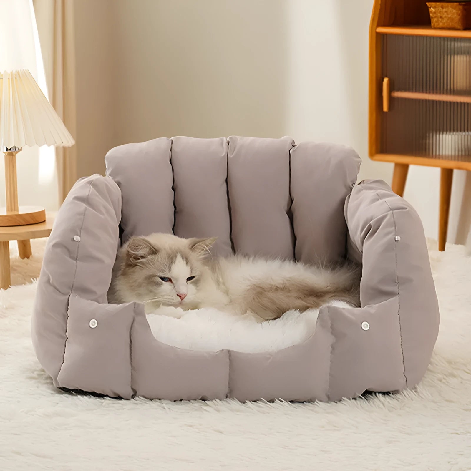 Grey arched fully enclosed cat nest bed with soft sofa exterior, shown next to a green one.