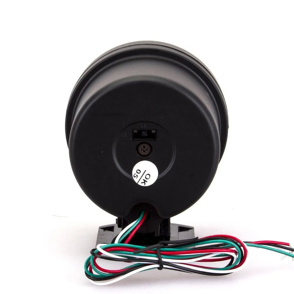 Black plastic automotive tachometer with blue light pointer display showing rpm scale