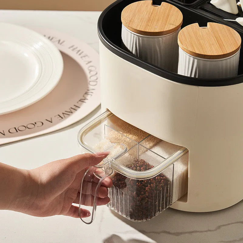White rotating kitchen storage container with cutlery holder and four-section spice box organiser.