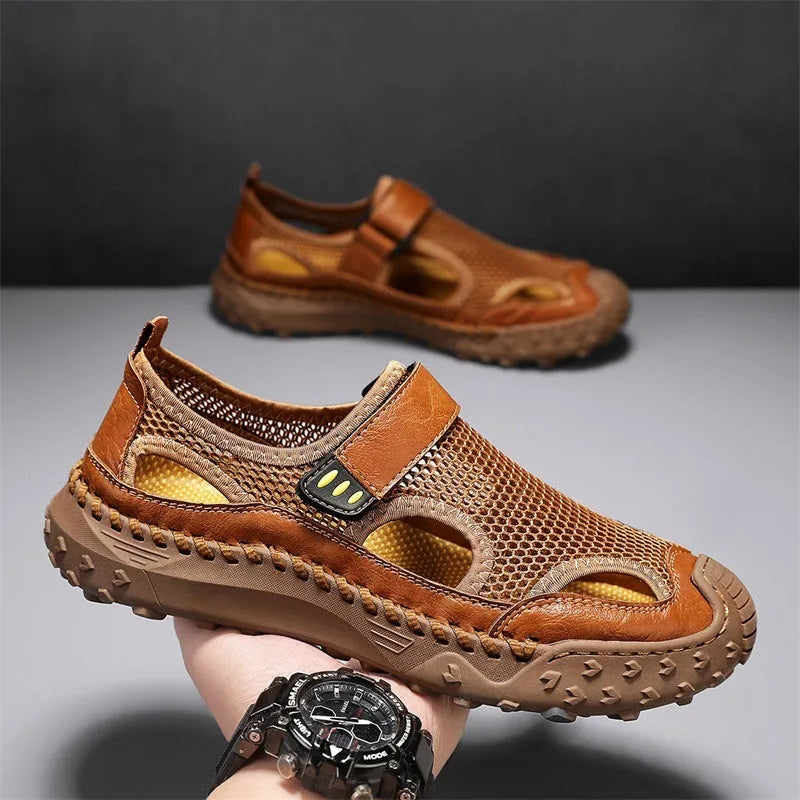 Men's black casual sandals with mesh upper and Velcro strap on a rubber sole.