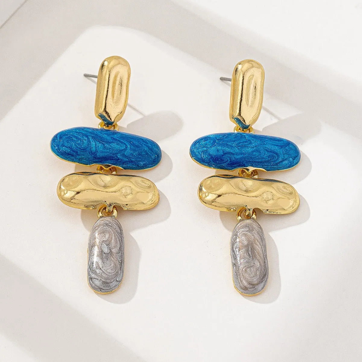 Geometric zinc alloy stud earrings with electroplated multicolour finish and butterfly fastenings