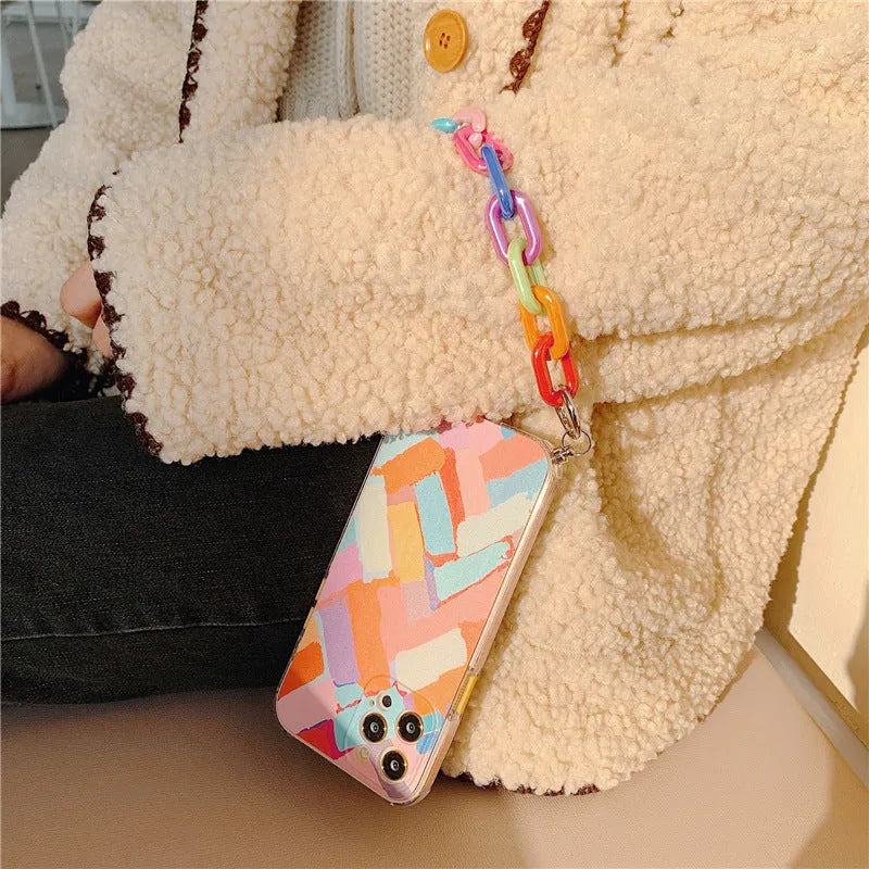 TPU mobile phone case with graffiti design and integrated bracelet for iPhone