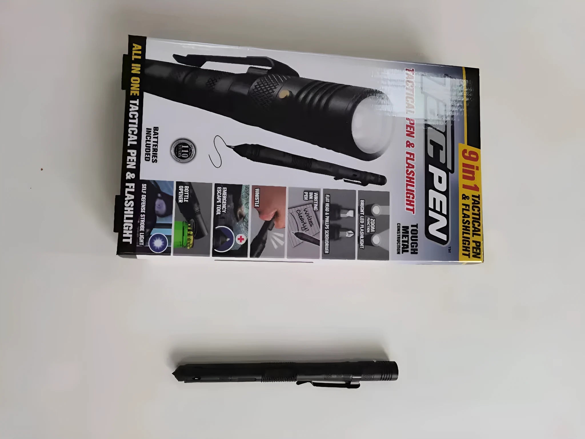 Nine-in-one multi-function flashlight survival pen in black with dual light sources and car window breaker