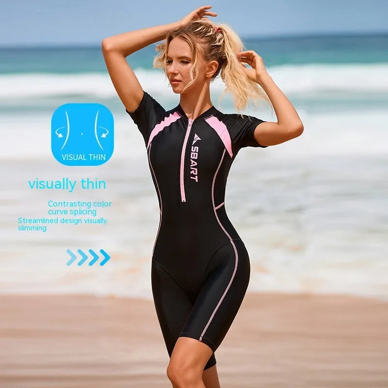 Solid colour one-piece surfing swimsuit for women with short sleeves and a chest pad.