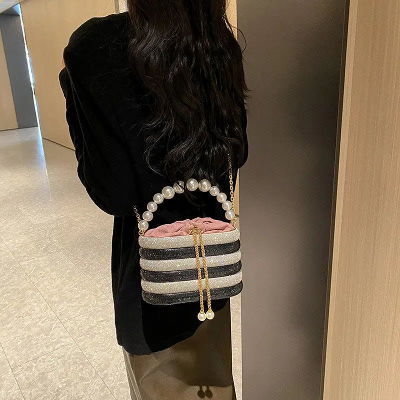Soft round PU women's crossbody dinner bag with beaded details in retro style.