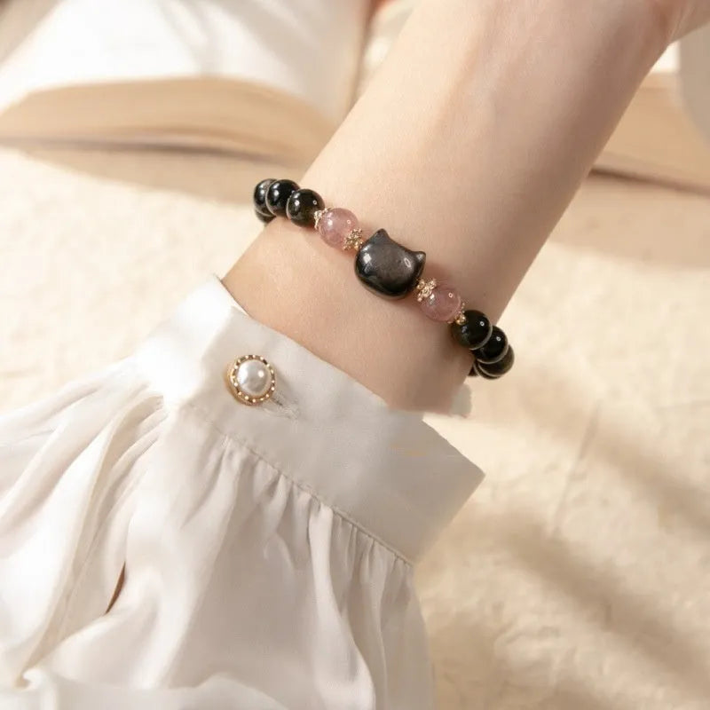 Black obsidian 8mm bead bracelet with silver kitty charms on adjustable closure