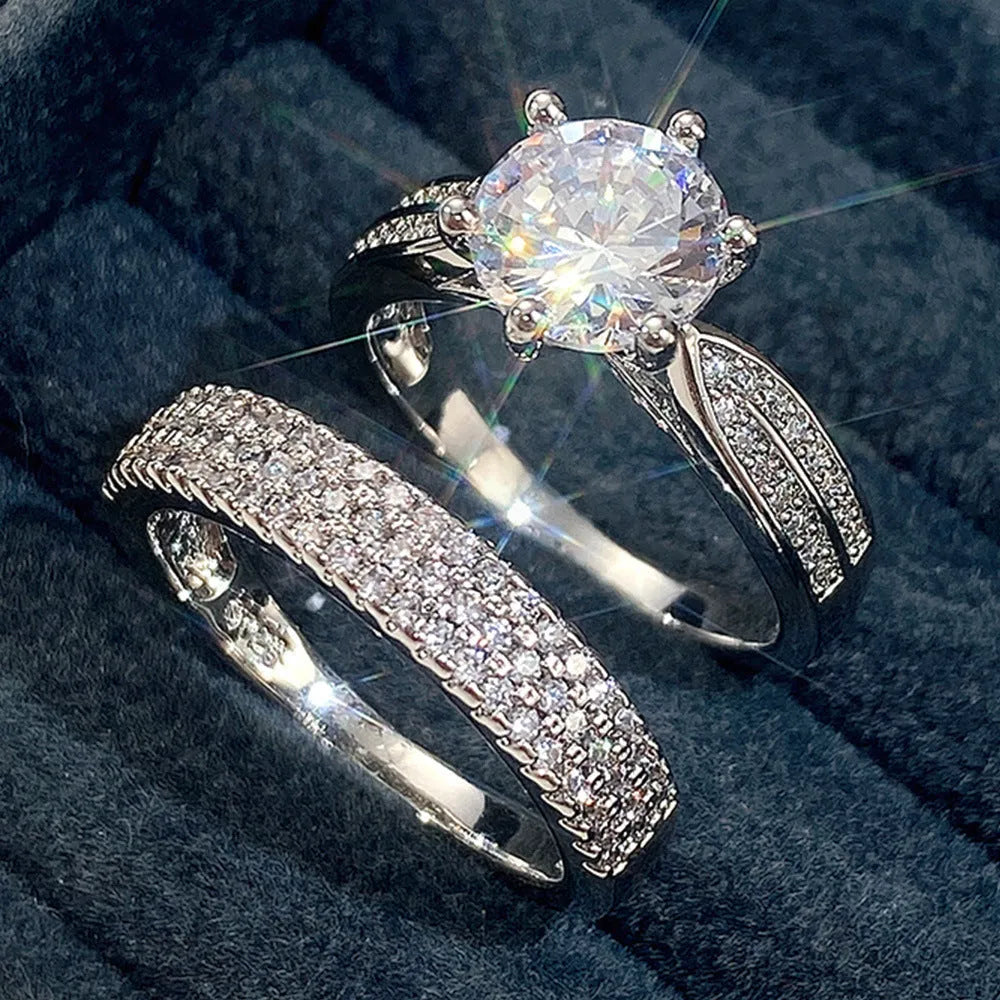 White gold colour alloy geometric wedding ring bracelet with round detail on a hand.