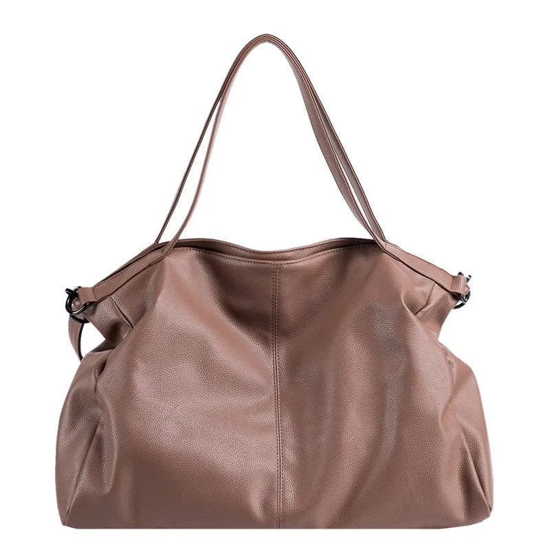 Large soft-surface PU messenger tote bag in black with zipper opening and adjustable shoulder strap