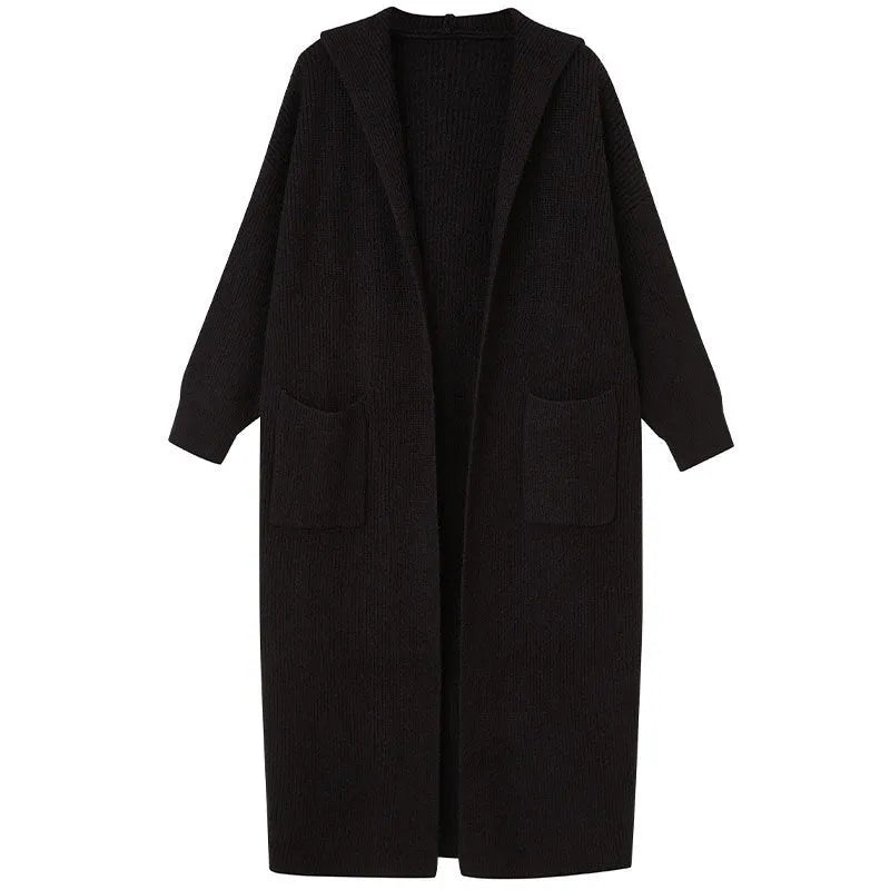 Long grey knitted women's cardigan with a hood, styled like a loose-fit trench coat.