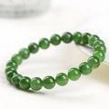 A single strand polished jasper bead bracelet in natural colours, showing different size options.