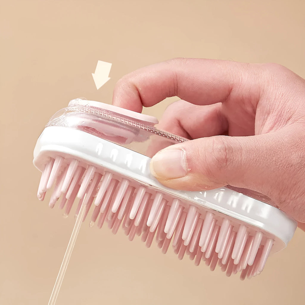 Grey silicone pet bath brush with flexible bristles and non-slip handle for washing dogs and cats.