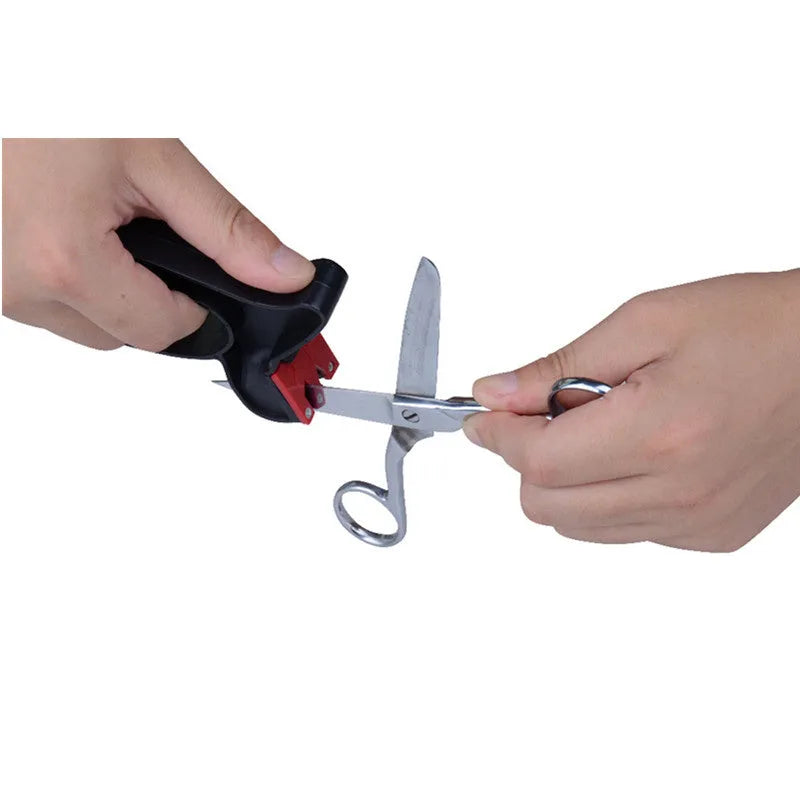 Black handheld knife and scissor sharpener tool on a white background.