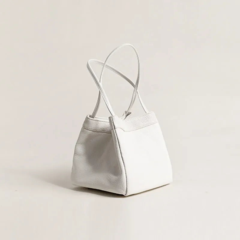 Cute small square bucket bag for women in textured PU, available in six solid colours including green and black.