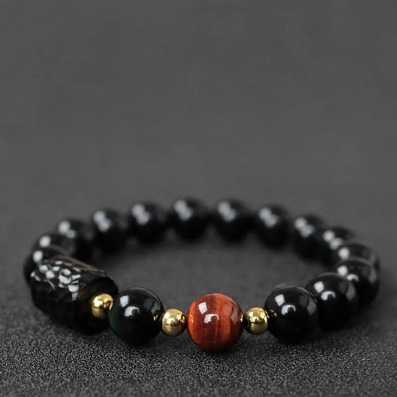 Handmade obsidian bracelet with red and yellow tiger eye beads in circle design