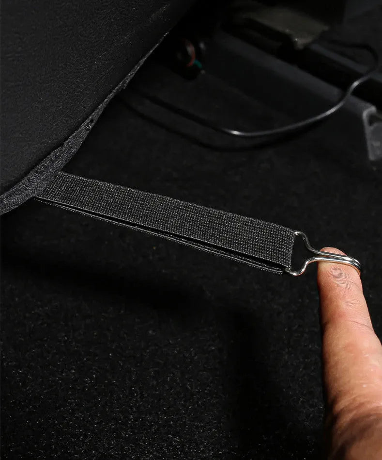 Black leather rear anti kick pad for car seat protection with a pocket.
