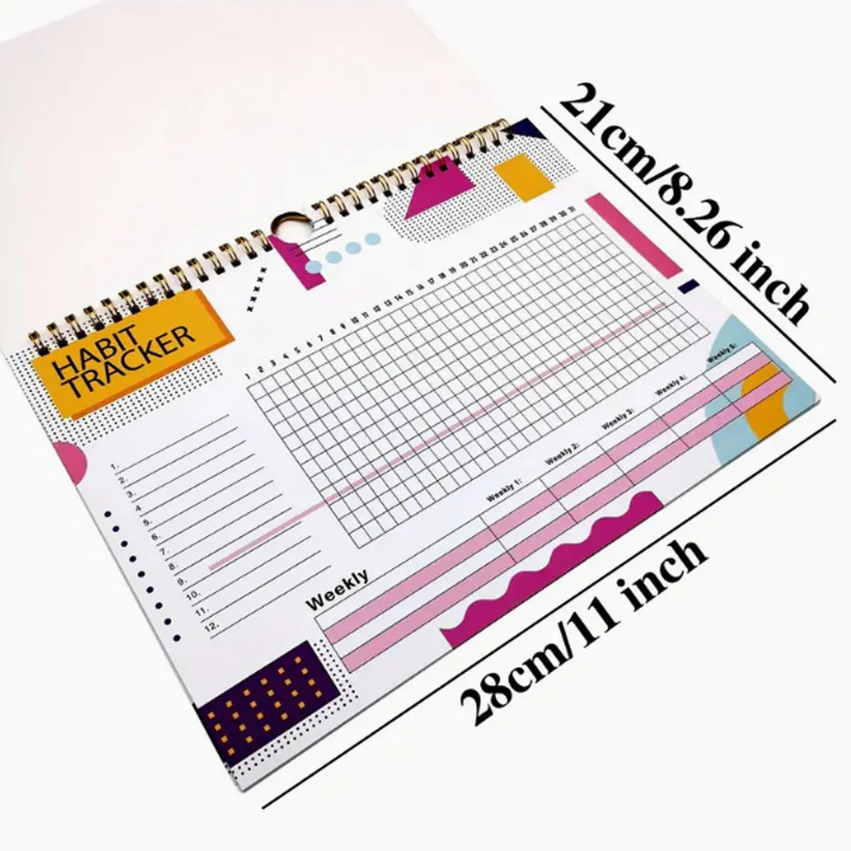A5 habit tracking planner book open on a table, showing interior pages for schedule recording.