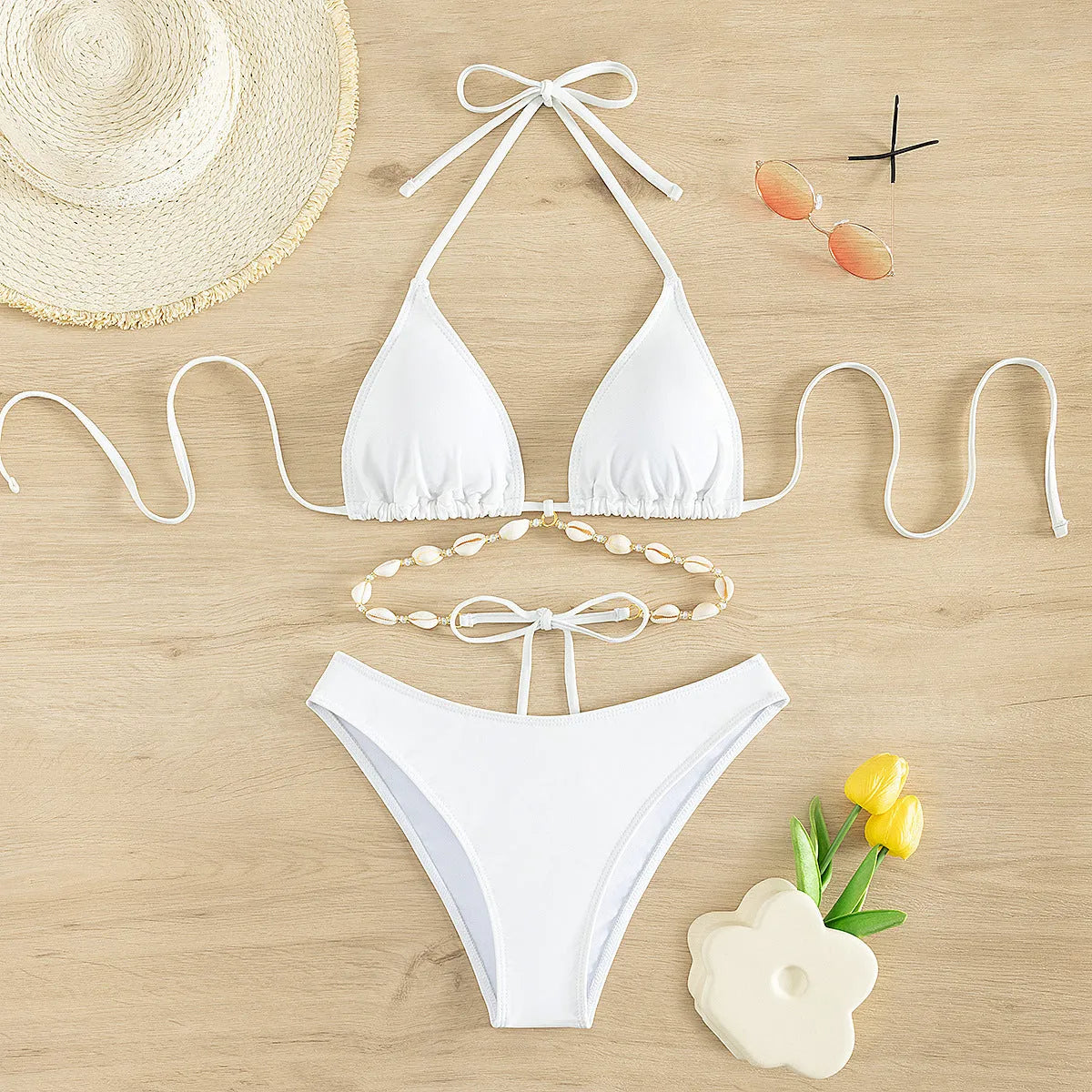 Women's black halter neck lace-up bikini swimsuit with briefs style on mannequin