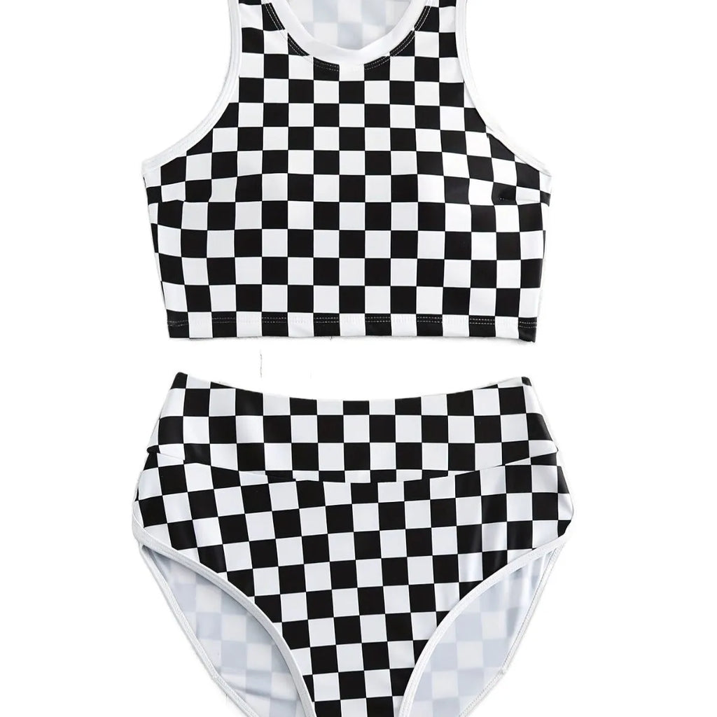 Backless one-piece women's swimsuit with black and white chessboard plaid pattern and white suspender straps.