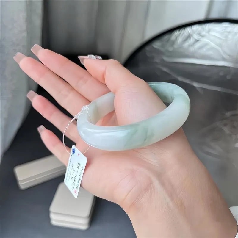 Tian Shan Cui bracelet with floating flowers design and animal zodiac modelling in ice-like jade