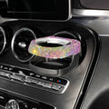 Diamond-decorated car cup holder bracket mounted on air vent in blue rhinestone finish