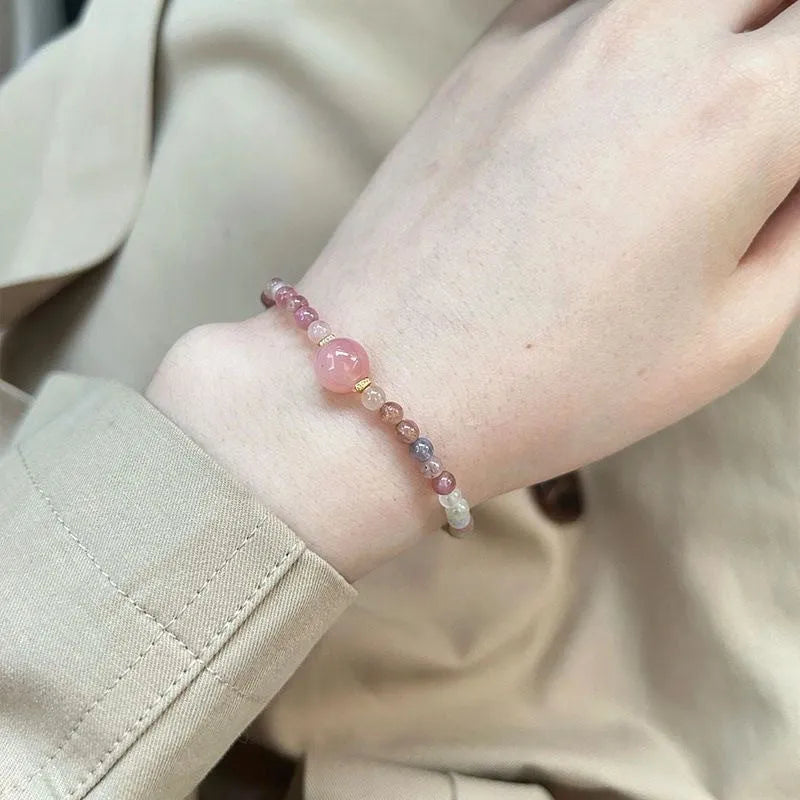 Women's geometric pink crystal bracelet with electroplated finish showing eight style variations
