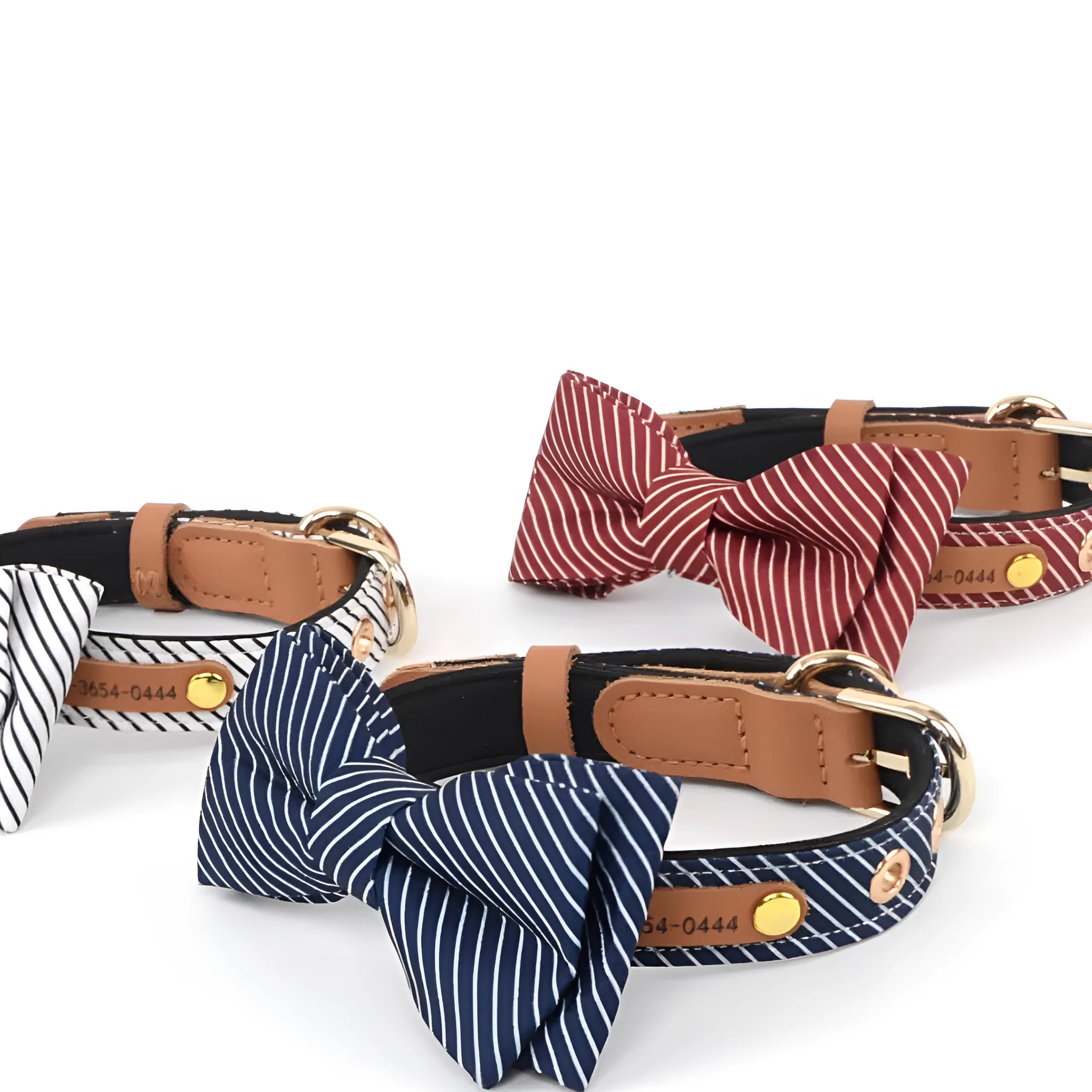 Simple dark blue cotton dog collar with a detachable white polka dot bow and metal buckle.