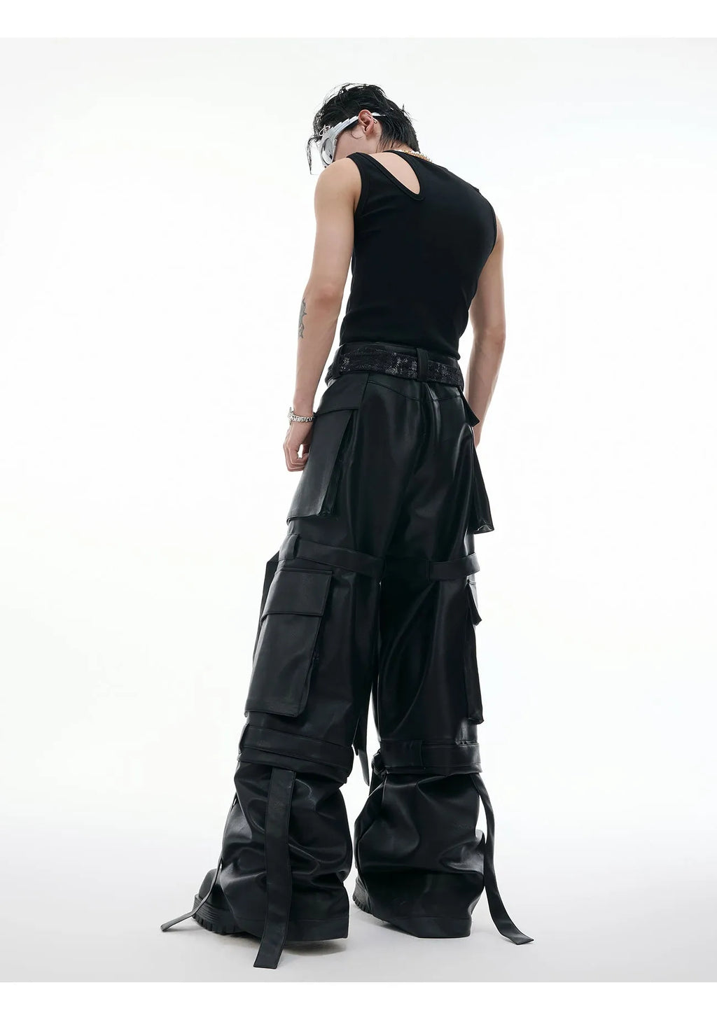Black loose fit leather trousers with quilted stitching detail and multiple pockets