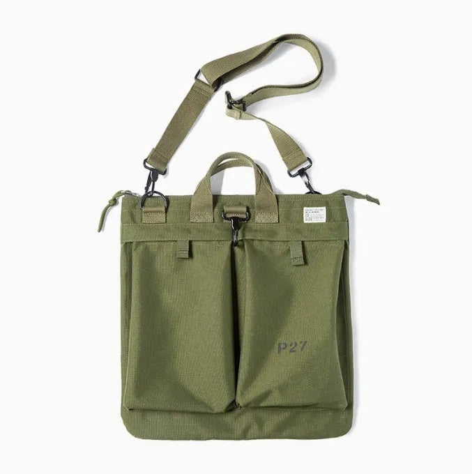 Marden canvas crossbody messenger bag in military green showing laptop compartment and shoulder strap