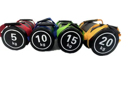 Flat white PVC fitness training sandbag shown in a gym setting for strength and conditioning workouts.