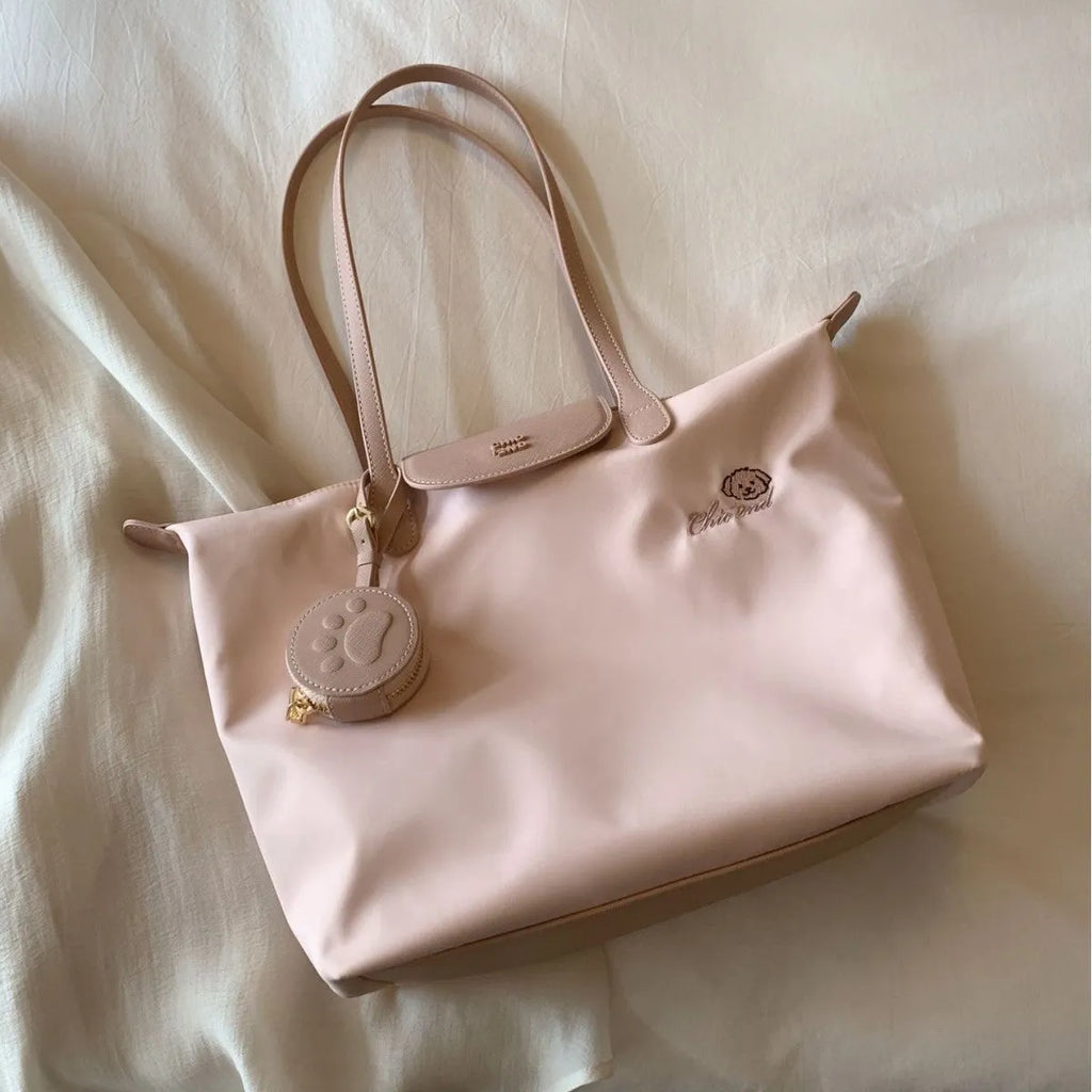 Beige Oxford cloth large capacity tote bag with shoulder strap showing horizontal square shape and sandwich pocket