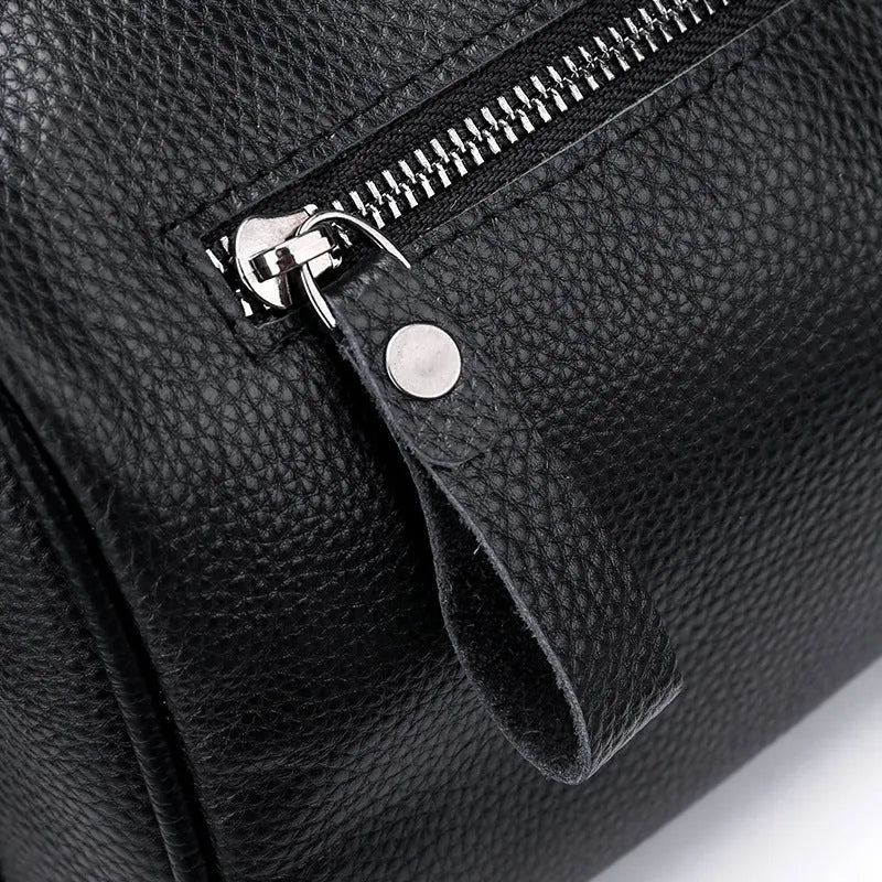 Black genuine leather one-shoulder crossbody bag with a large capacity.