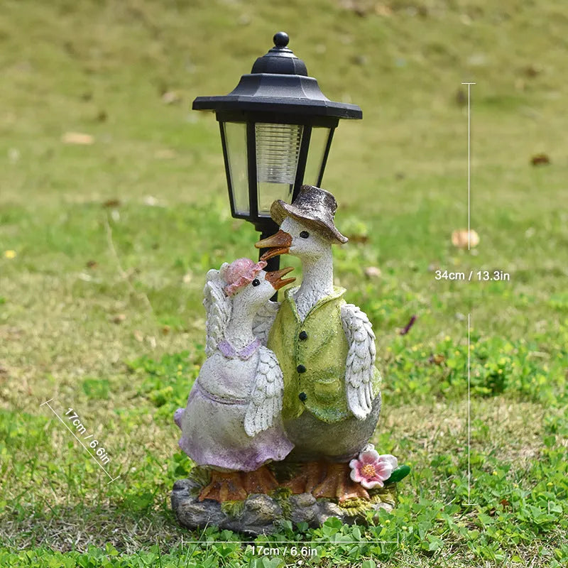 Hexagonal solar garden lamp with animal sculpture decoration in outdoor setting