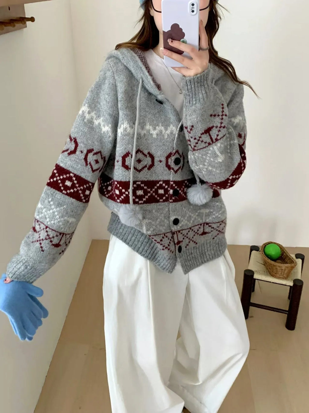 Loose grey brocade sweater coat with geometric pattern on a plus-size model.