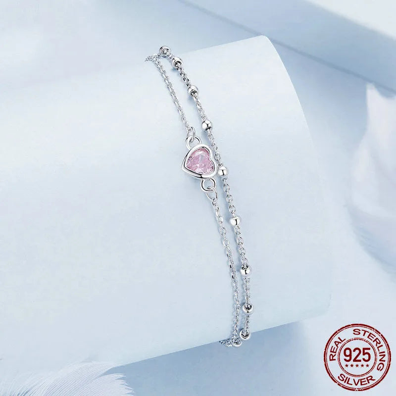 Sweet girlish heart-shaped 925 sterling silver bracelet on wrist, colour BSB152.