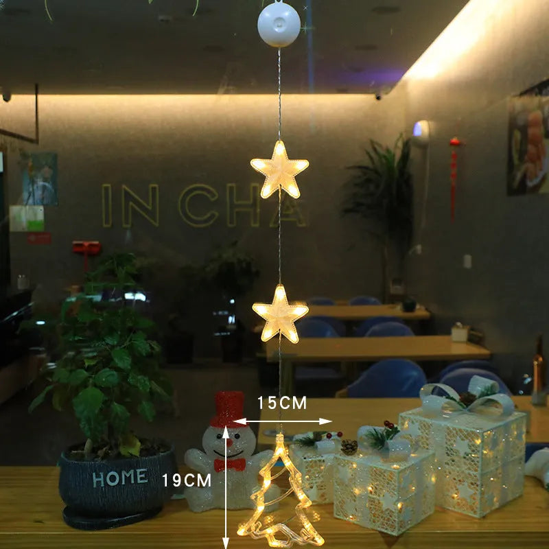 Set of three battery-powered LED Christmas pendant lights with suction cups, showing star, tree, and deer designs.