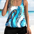 Blue tie-dyed floral print women's bikini set on a hanger, showing top and shorts.