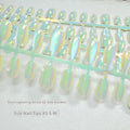 Set of electroplated Cat's Eye and Aurora effect press-on false nails in short ladder shape on a white background.