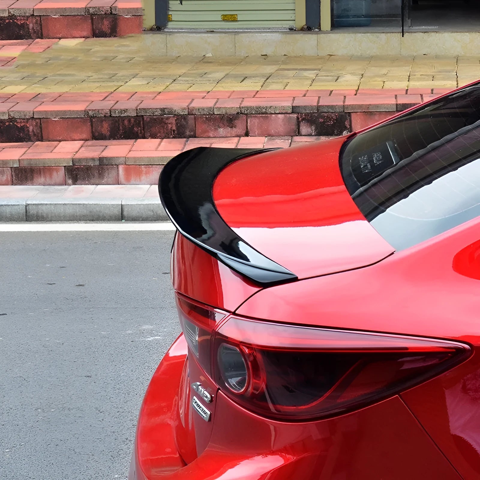 Bright black tail trim spoiler for Mazda 3 Axela Exela 2014-2021 models on rear of car