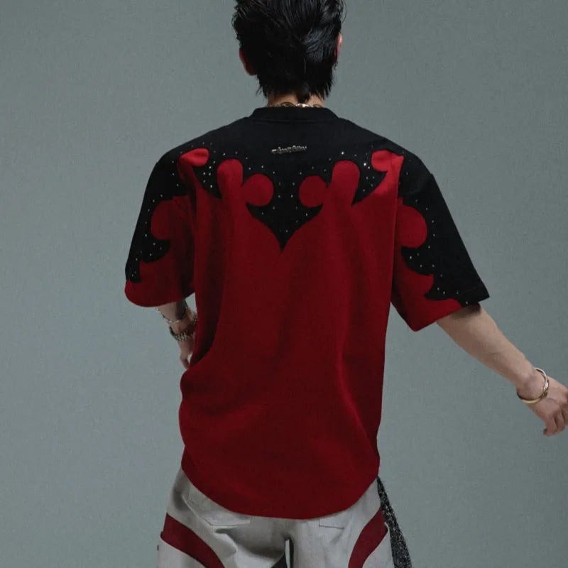 Men's grey cotton t-shirt with burnt flower embroidery and rhinestone details on the front.